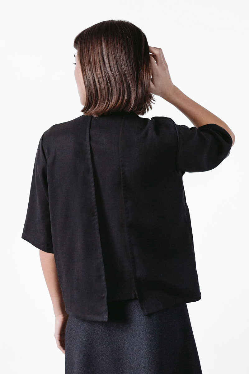 black shirt with asymmetrical hem and short sleeves